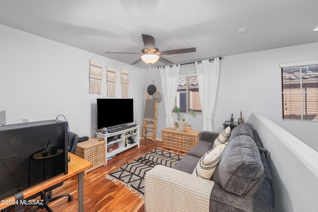 living room featuring hardwood / wood-style flooring and ceiling fan