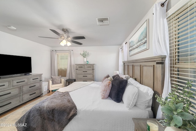 bedroom featuring light hardwood / wood-style floors and ceiling fan