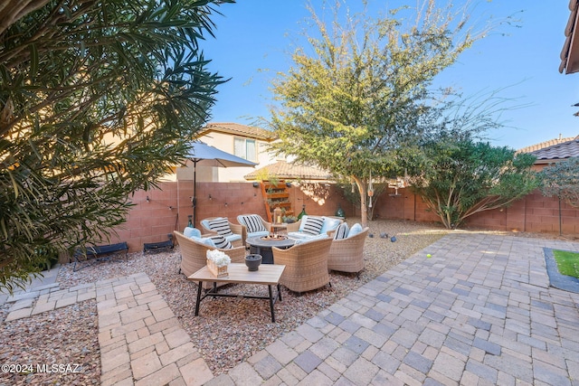 view of patio / terrace with an outdoor fire pit