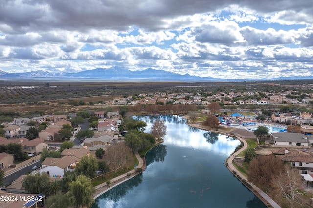 birds eye view of property featuring a water and mountain view