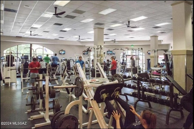 exercise room featuring a drop ceiling and ceiling fan