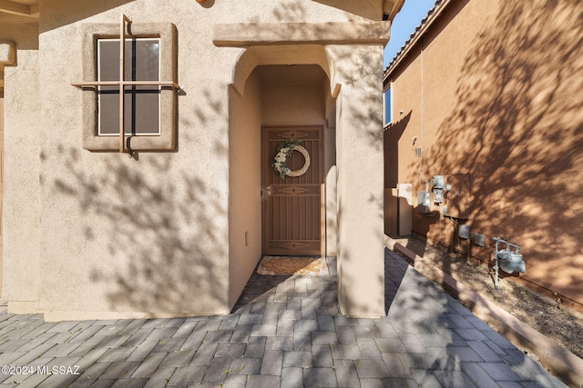 doorway to property with a patio area