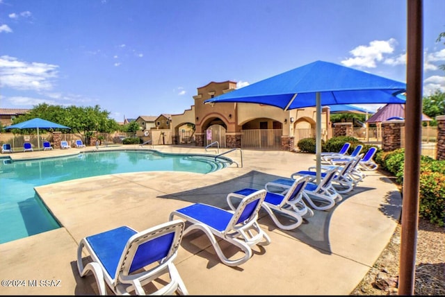 view of swimming pool with a patio