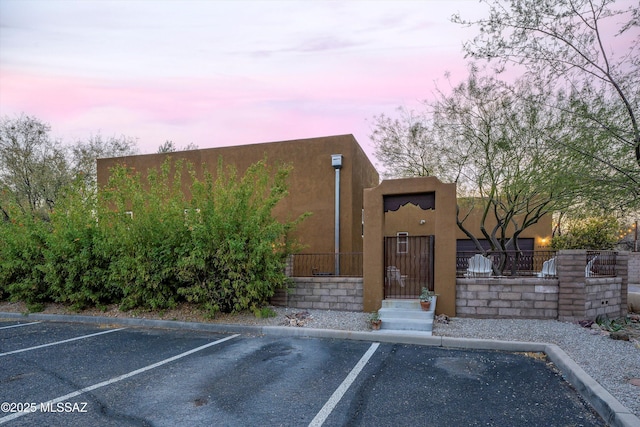 view of outdoor building at dusk