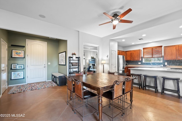 dining room featuring ceiling fan and light tile patterned floors