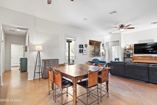 dining room with ceiling fan and light tile patterned flooring