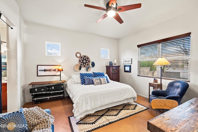 bedroom featuring multiple windows and ceiling fan