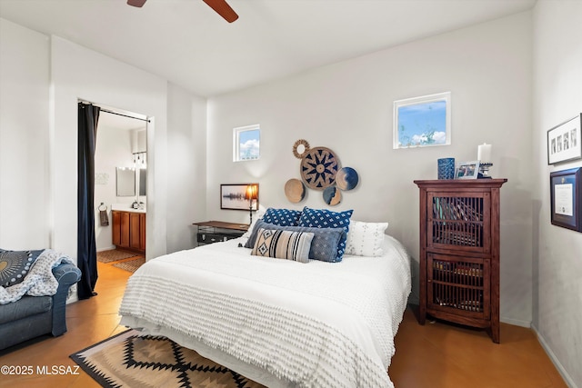 bedroom with connected bathroom and ceiling fan