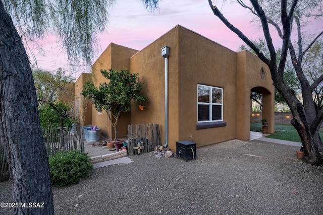 view of property exterior at dusk