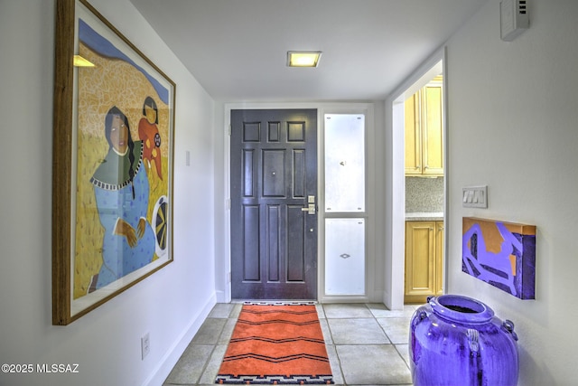 foyer entrance featuring light tile patterned floors