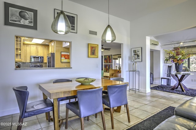 dining area featuring light tile patterned floors