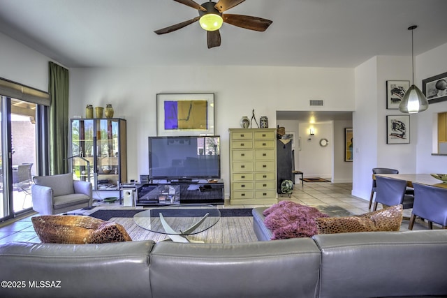 living room with light tile patterned flooring and ceiling fan