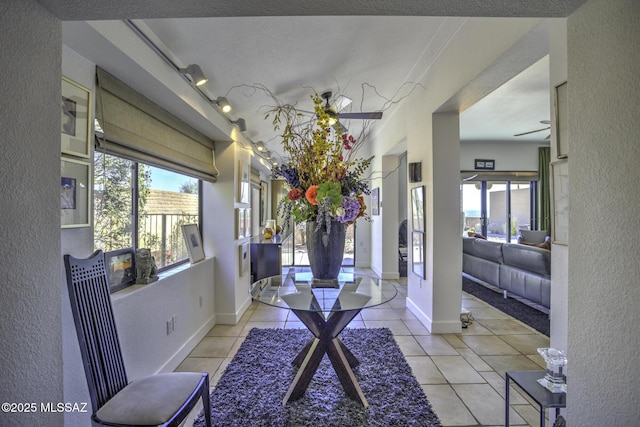 interior space featuring a wealth of natural light and light tile patterned floors