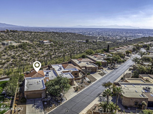 birds eye view of property featuring a mountain view