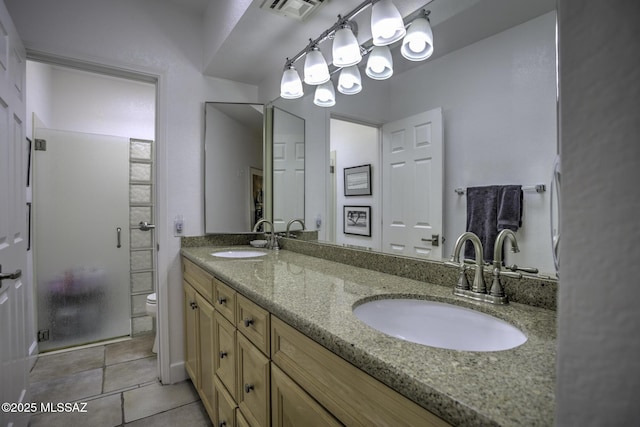 bathroom with walk in shower, tile patterned floors, vanity, and toilet