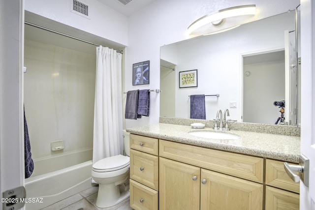 full bathroom featuring vanity, shower / tub combo with curtain, tile patterned floors, and toilet