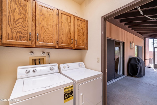 laundry room with cabinets and separate washer and dryer