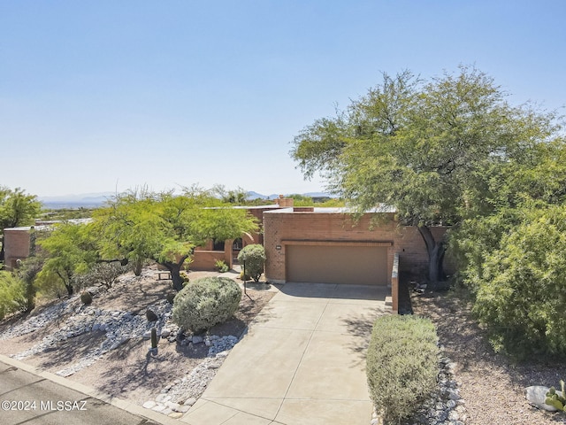 southwest-style home featuring a garage