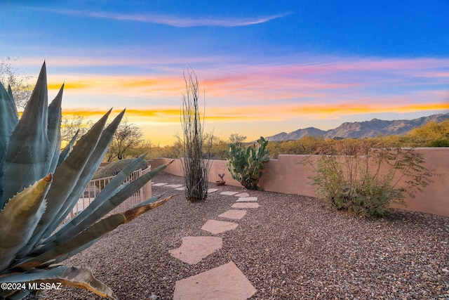 yard at dusk with a mountain view