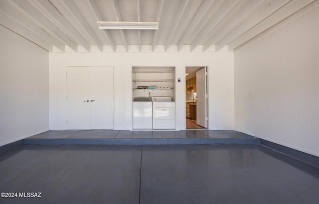 garage with washing machine and clothes dryer