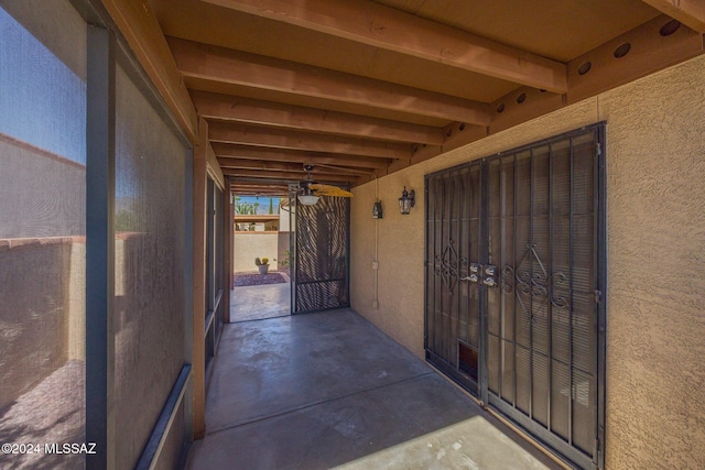 doorway to property with ceiling fan