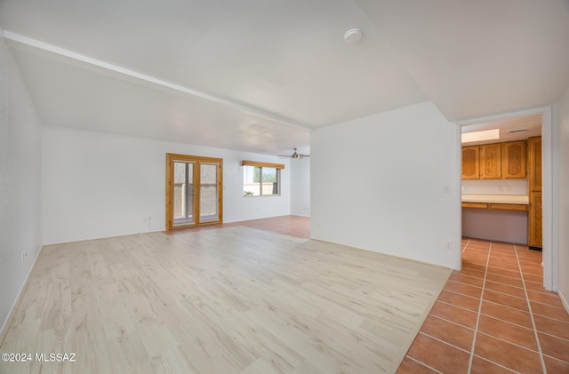 spare room featuring light hardwood / wood-style floors and ceiling fan