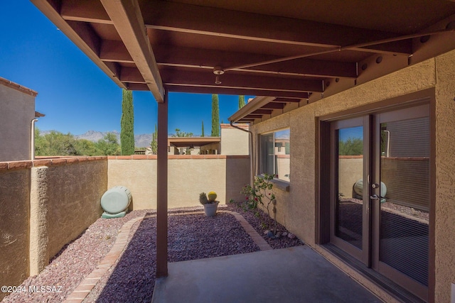 view of patio featuring french doors