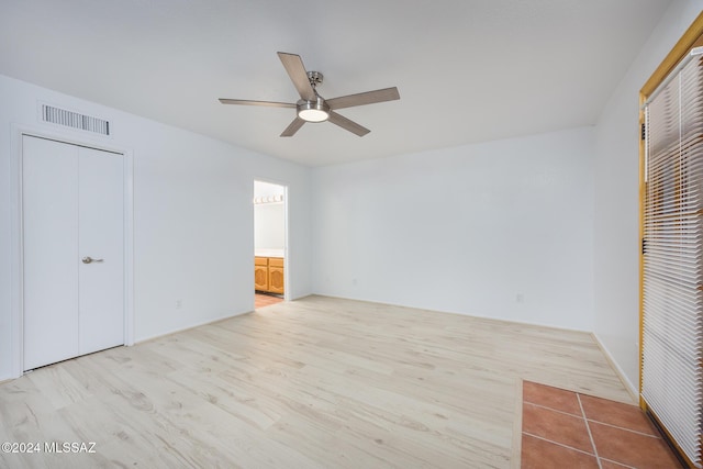 unfurnished bedroom featuring light hardwood / wood-style flooring and ceiling fan