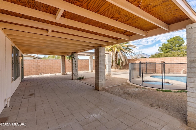 view of patio / terrace with a fenced in pool