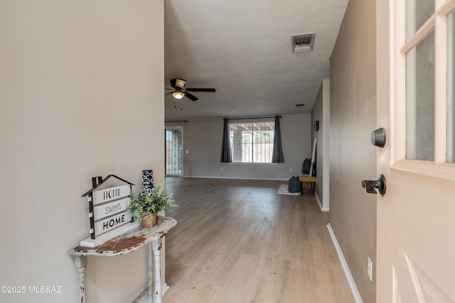 interior space featuring ceiling fan and light hardwood / wood-style flooring