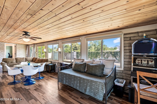 interior space featuring ceiling fan and wooden ceiling