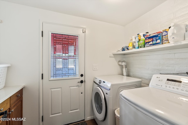 clothes washing area with washer and dryer