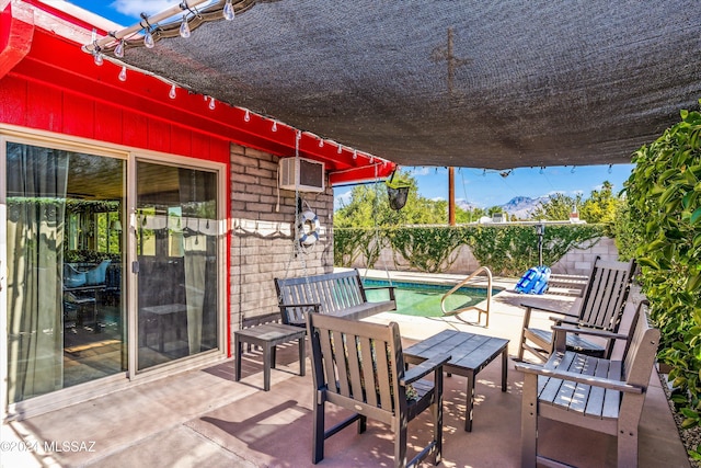 view of patio / terrace with a fenced in pool