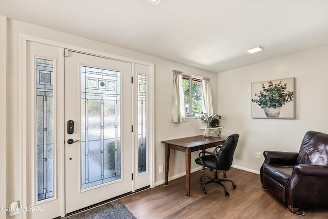 home office with wood-type flooring