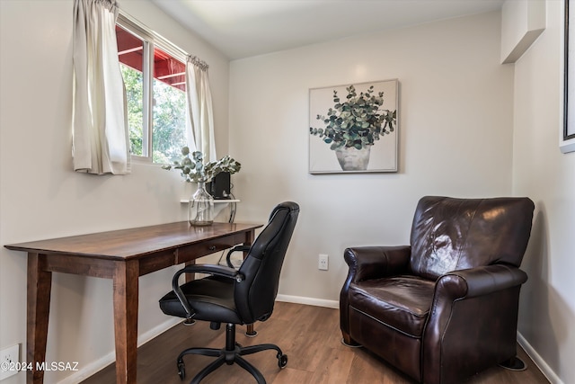 home office with hardwood / wood-style floors