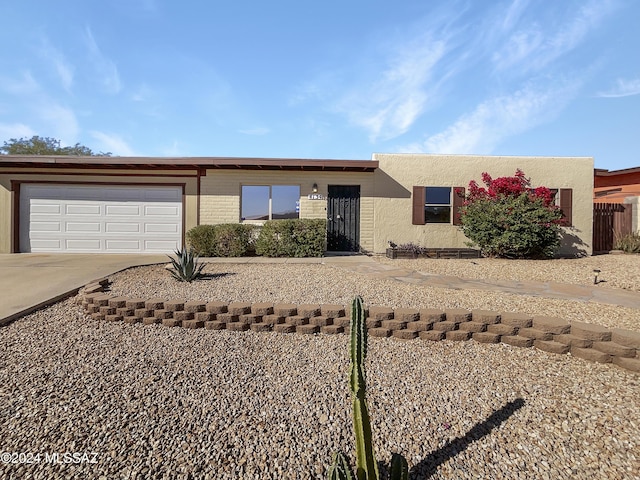 ranch-style home with a garage