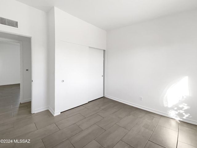 unfurnished bedroom featuring a closet