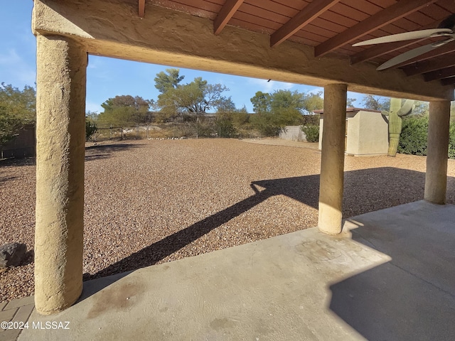 view of yard featuring a patio area and a shed