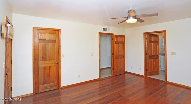 unfurnished bedroom featuring dark hardwood / wood-style flooring