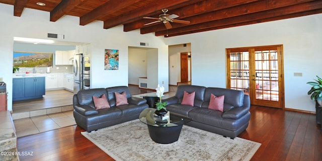 living room featuring hardwood / wood-style flooring, beamed ceiling, and french doors