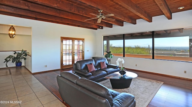 living room featuring french doors, beam ceiling, hardwood / wood-style floors, and wooden ceiling