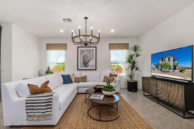 dining room featuring a mountain view, light tile patterned flooring, and an inviting chandelier