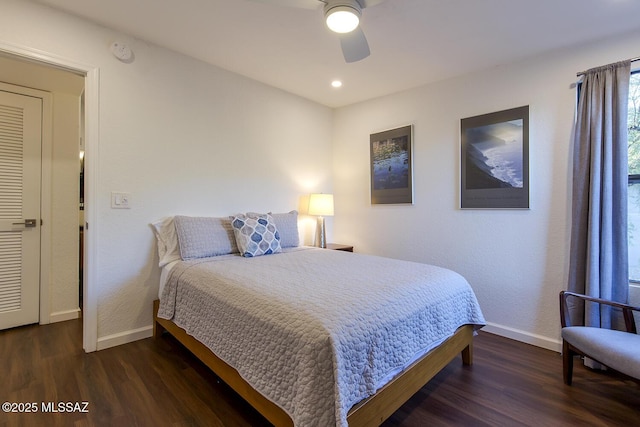 bedroom featuring ceiling fan and dark hardwood / wood-style flooring