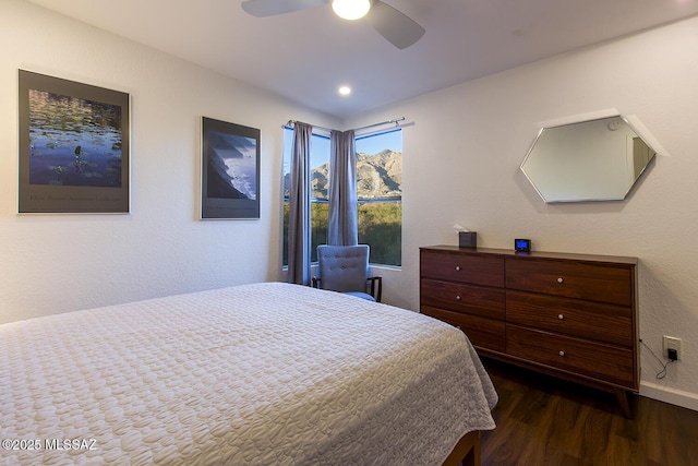 bedroom featuring ceiling fan and dark hardwood / wood-style floors