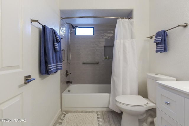 full bathroom with shower / bath combo with shower curtain, vanity, hardwood / wood-style floors, and toilet