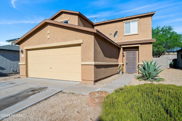 front of property with a garage