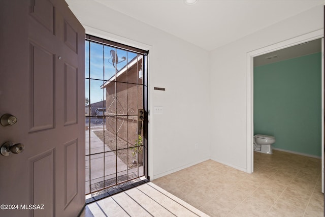 entrance foyer featuring light tile patterned floors