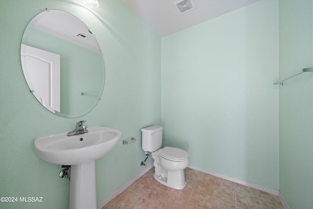 bathroom featuring toilet