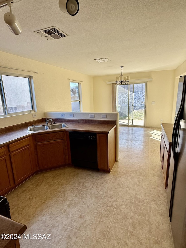 kitchen featuring dishwasher, a healthy amount of sunlight, and sink