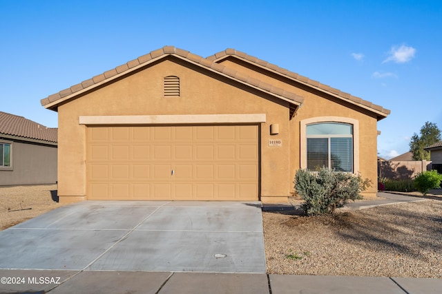 single story home with a garage